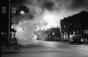 City cars, crime and bustle of Detroit on a clear, contrast, black and white photography.